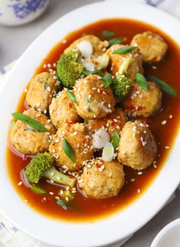 aerial shot of Asian chicken meatballs in a white platter