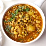 aerial shot of Punjabi lobia masala in a white ceramic bowl