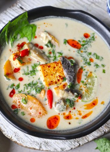 aerial shot of Thai coconut soup in a black bowl