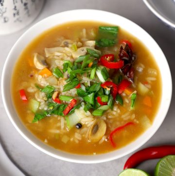 aerial shot of rice soup served in a ceramic bowl