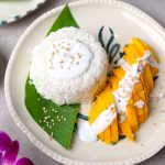 aerial shot of Thai mango sticky rice served on a ceramic platter
