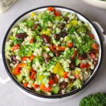 aerial shot of green barley salad in a white ceramic bowl