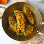 aerial shot of bharwa karela in a brass platter - 11