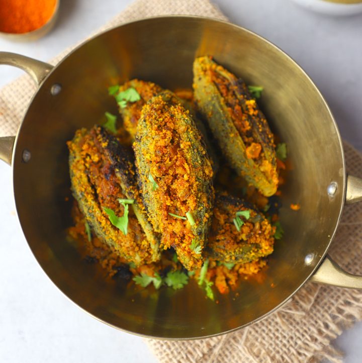 aerial shot of bharwa karela in a brass platter