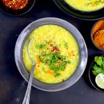 aerial shot of mulligatawny soup in a grey ceramic bowl