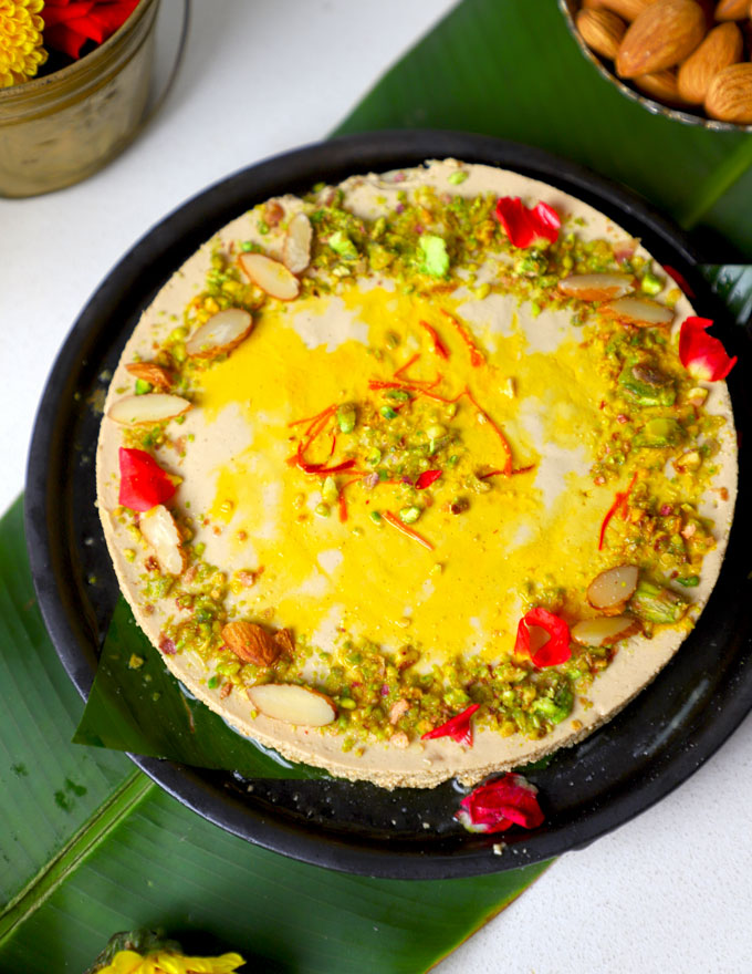 aerial shot of bhapa doi served in a black ceramic platter.