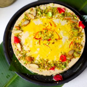 aerial shot of bhapa doi served in a black platter