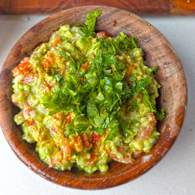 making guacamole in a mortar and pestle