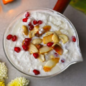 Pomegranate and cashew coconut milk smoothie in a glass. - 7