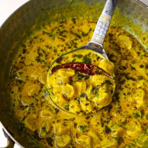 close up shot of gatte ki sabzi in a kadhai. - 11