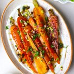 aerial shot of balsamic roasted carrots served with Greek yogurt