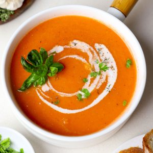 aerial shot of roasted tomato soup served in a pan.