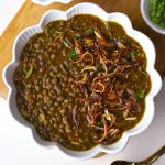 aerial shot of whole masoor dal in a white ceramic bowl