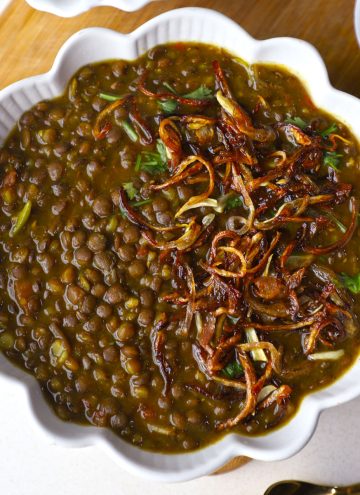 aerial shot of whole masoor dal in a white ceramic bowl