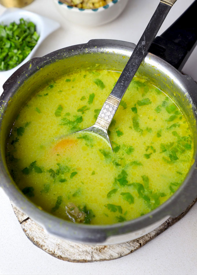 side close up shot of shorba in a pressure cooker.  - 25