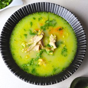 aerial shot of chicken shorba in a black ceramic bowl. - 28
