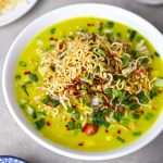 side close up shot of khao suey served in a white bowl. - 14