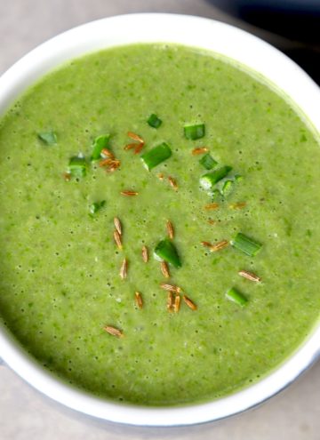 aerial shot of mushroom spinach soup in a bowl.
