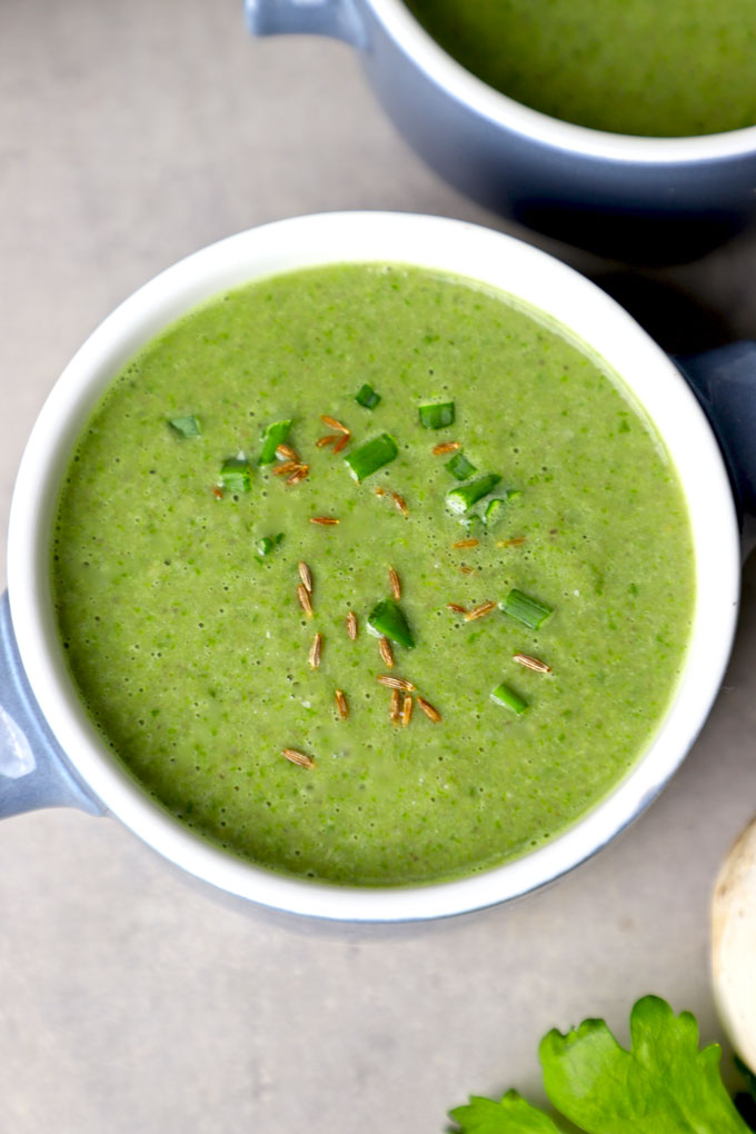 aerial shot of mushroom spinach soup in a bowl. - 1