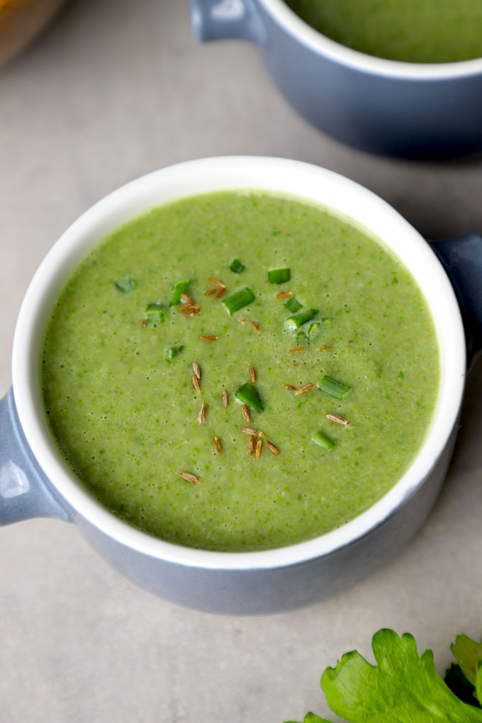 side aerial shot of mushroom spinach soup in a bowl. - 7