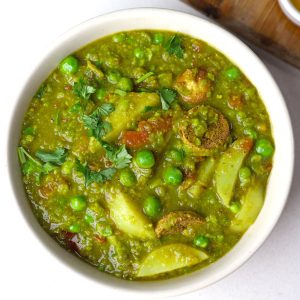 aerial shot of matar ka nimona served in a cream bowl.