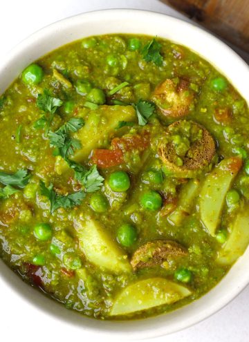 aerial shot of matar ka nimona served in a cream bowl.