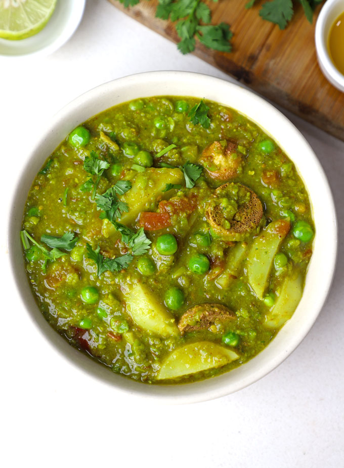 aerial shot of matar ka nimona served in a cream ceramic bowl.