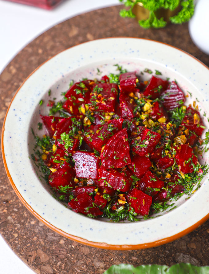 side aerial shot of beetroot salad in a ceramic bowl. - 12