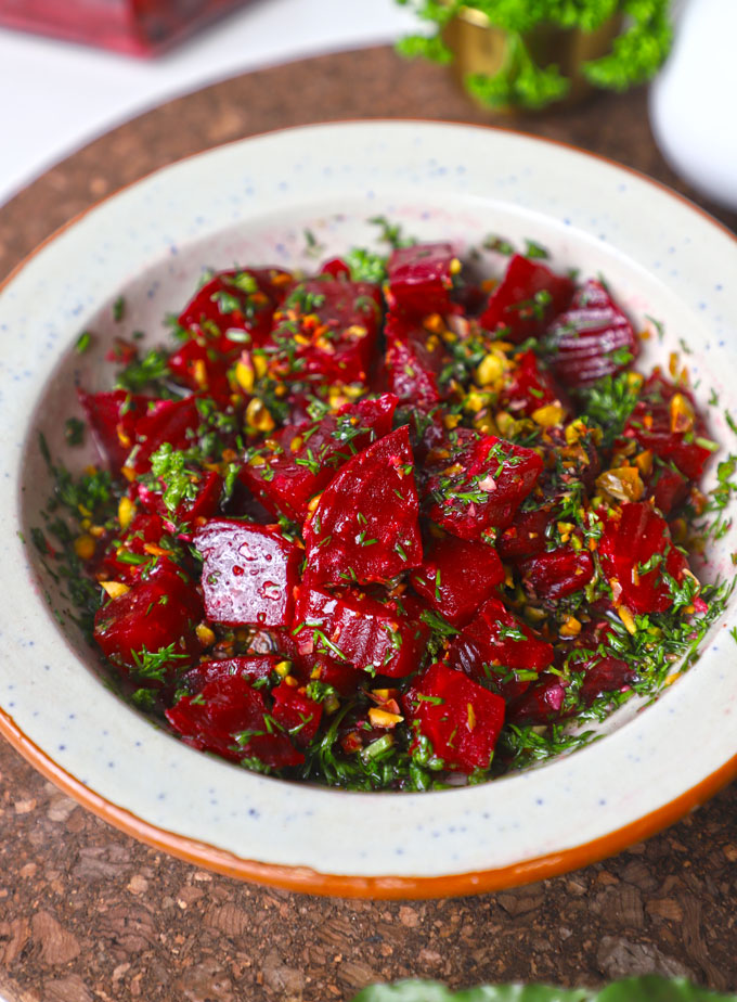 side close up shot of beetroot salad in a ceramic bowl. - 6