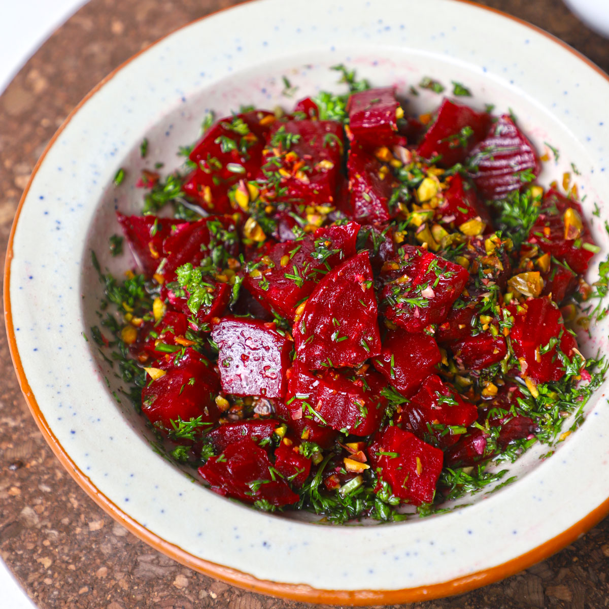 side close up shot of beetroot salad in a ceramic bowl. - 3