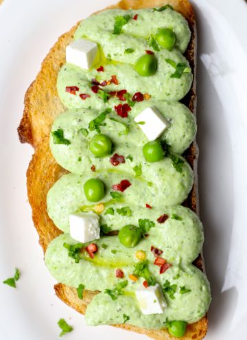 aerial shot of matra paneer toast served on a white platter.