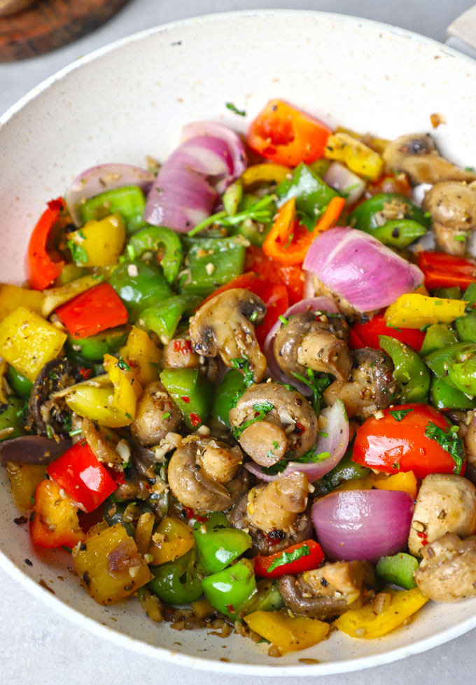 side close up shot of mushroom pepper fry in a stir fry pan. - 7