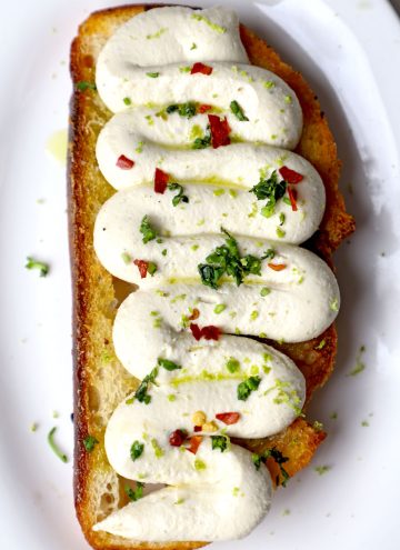 aerial shot of whipped toafu toast served on a white platter.