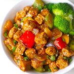 side close up shot of tempeh stir fry in a bowl.