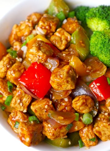 side close up shot of tempeh stir fry in a bowl.