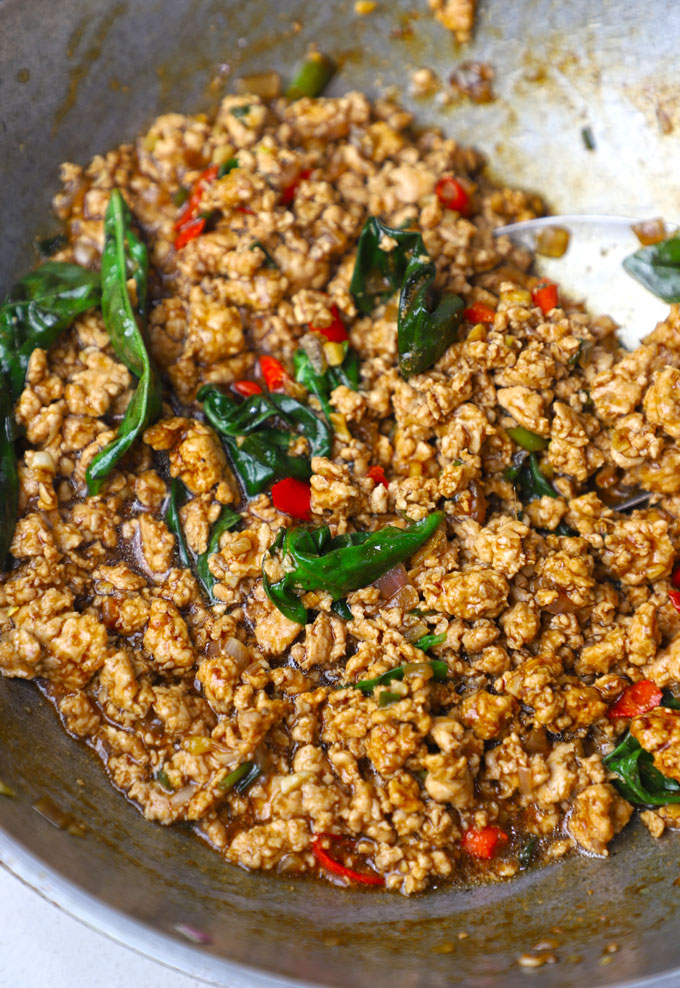 close up shot of Thai basil chicken in a wok. - 14