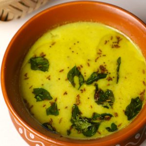 side close up shot of karichi kadhi in a clay pot.