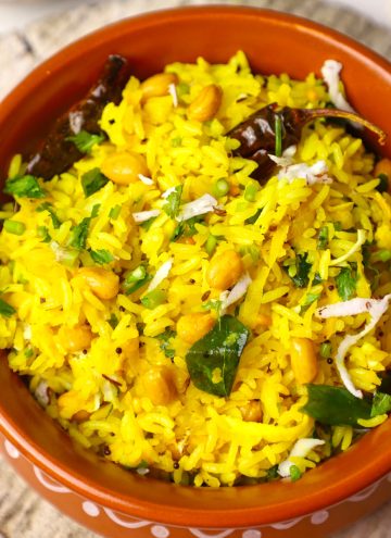 aerial close up shot of mango rice in an earthen pot.