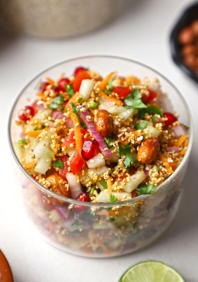 side close up shot of rajgira bhel puri in a glass jar.