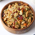 side close up shot of amaranth granola in a bowl.