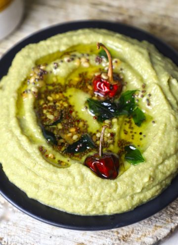 side close up shot of sorakaya chutney in a black platter.