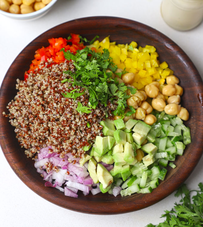 aerial shot of quinoa salad ingredients in a bowl.
