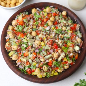 aerial shot of quinoa chickpea salad served in a wooden bowl.