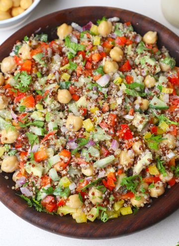 aerial shot of quinoa chickpea salad served in a wooden bowl.