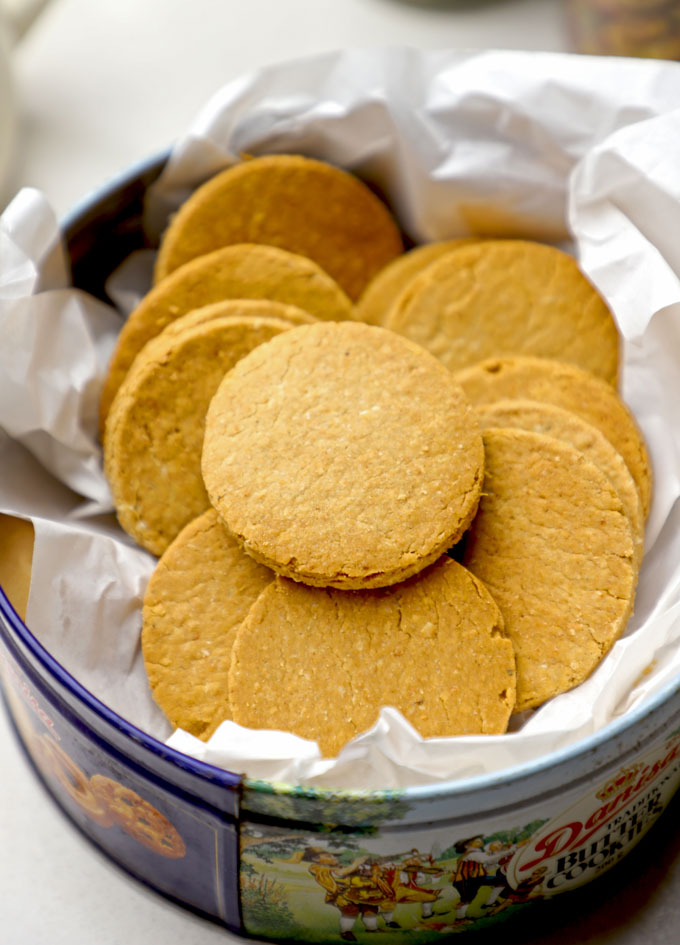 aerial shot of jowar cookies stacked in a box.