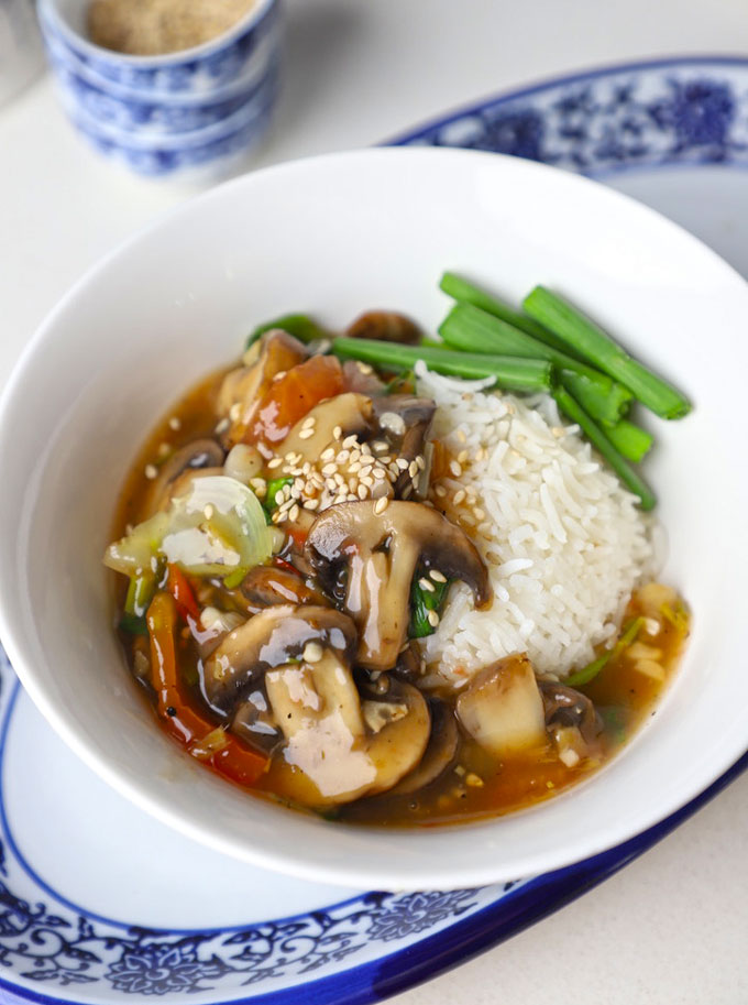 side close up shot of Asian style mushrooms served with rice.