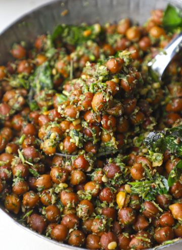 side close up shot of brown chana sundal served in a stainless steel bowl.