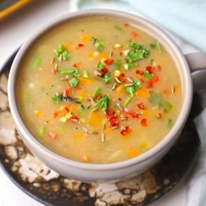 aerial shot of low calorie jowar soup in a bowl.