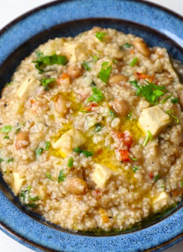 aerial shot of samak rice khichdi served in a blue bowl.